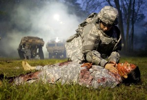 Sgt. Gallagher Assesses Mock Casualty
